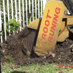 A bulldozer digging a hole in the ground.